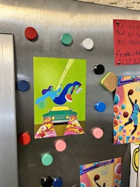 a refrigerator with a bunch of magnets on it