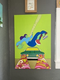 a painting of a man on a skateboard hanging on a wall